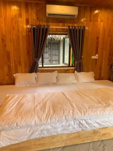 Ένα ή περισσότερα κρεβάτια σε δωμάτιο στο Homestay Nhà của Mị - Mị's House