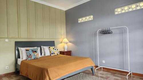 Ένα ή περισσότερα κρεβάτια σε δωμάτιο στο Alessandra Villa