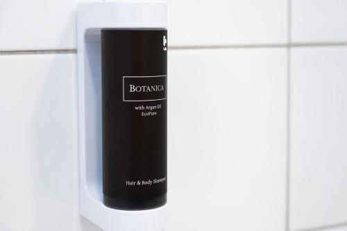a bottle of shampoo sitting on top of a counter at Hotel Landskron in Bruck an der Mur
