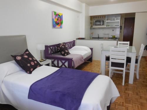 Ένα ή περισσότερα κρεβάτια σε δωμάτιο στο Studio en Microcentro