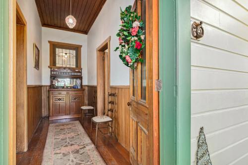 a room with a door with a wreath on it at Aranui palms - Mapua Holiday Home in Mapua