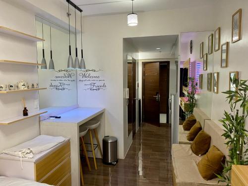 a room with a counter and a desk in it at Woodland Elegance Retreat Symphony of Artistry with Blazing fast 300 Mbps in Manila