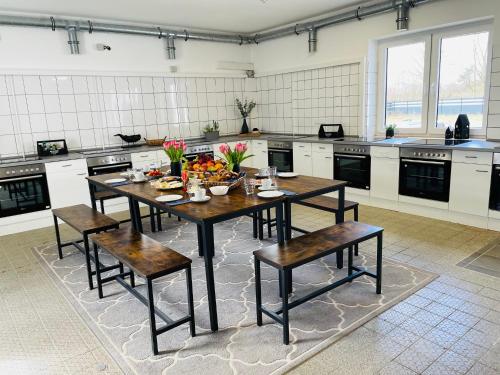 a kitchen with a table with a bowl of fruit on it at Monteurzimmer in Kevelaer in Kevelaer