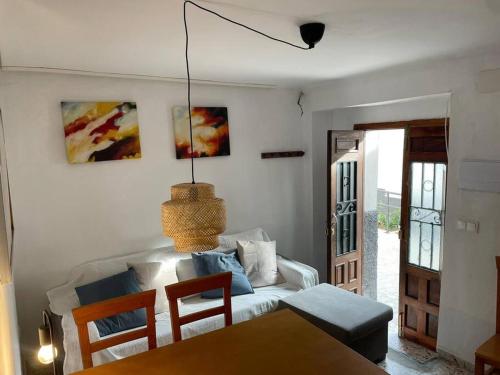 a living room with a couch and a table at La casita de la fuente in Cazorla