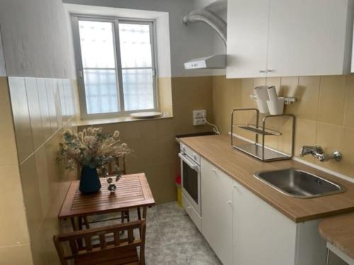 a kitchen with a sink and a counter top at La casita de la fuente in Cazorla