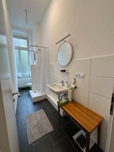 a bathroom with a sink and a mirror at urban-studios-cologne I studio in Cologne