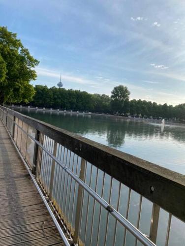 a bridge over a body of water next to a river at urban-studios-cologne I studio in Cologne