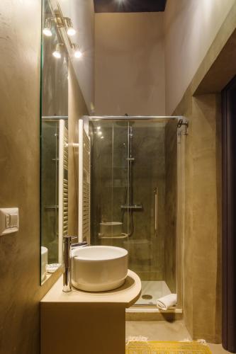a bathroom with a sink and a shower at Lo Scrigno in Foligno