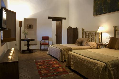 Katil atau katil-katil dalam bilik di Hotel La Casona de Tita