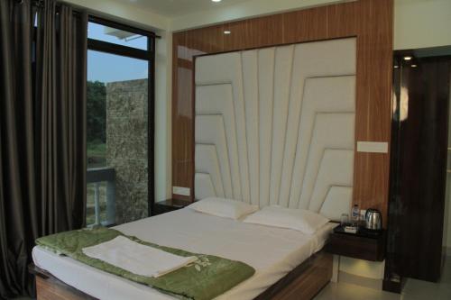 Postelja oz. postelje v sobi nastanitve Bishnupur River Side Resort