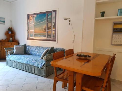 a living room with a couch and a table at Guest House Baia dei Sogni in Rapallo