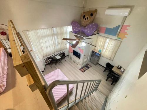 an overhead view of a living room with a ceiling fan at Peace 28 B&B in Jincheng