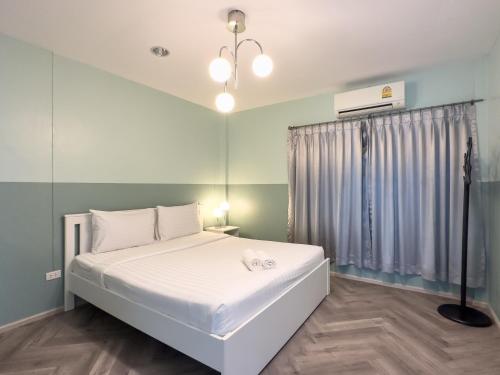 Postel nebo postele na pokoji v ubytování Nadda Pool Villa Ranong