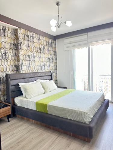 a bedroom with a large bed in a room at Harika konumlu popüler ev 2+1 in Kaleköy