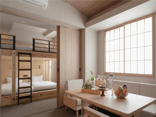 a room with a desk and a bunk bed at MIMARU SUITES Tokyo NIHOMBASHI in Tokyo