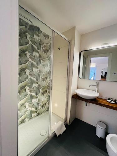 a bathroom with a shower and a sink at CIVICO 27 rooms in Magliano in Toscana