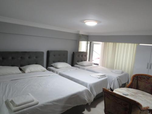 Кровать или кровати в номере kaya hotel