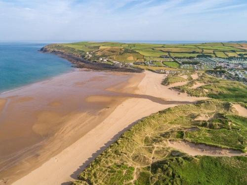 an aerial view of a beach and the ocean at 2 Bed in Tiverton 77884 in Bolham