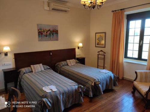 Ein Bett oder Betten in einem Zimmer der Unterkunft Riotinto Victorian House