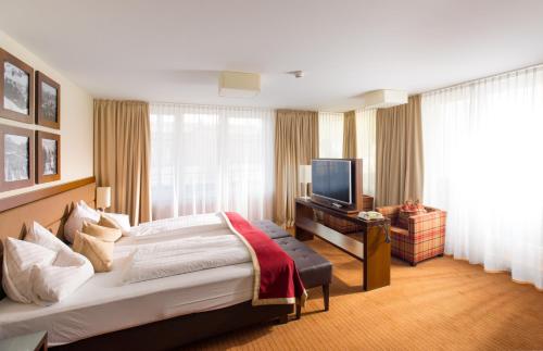 Postel nebo postele na pokoji v ubytování Hotel Stadt Kufstein