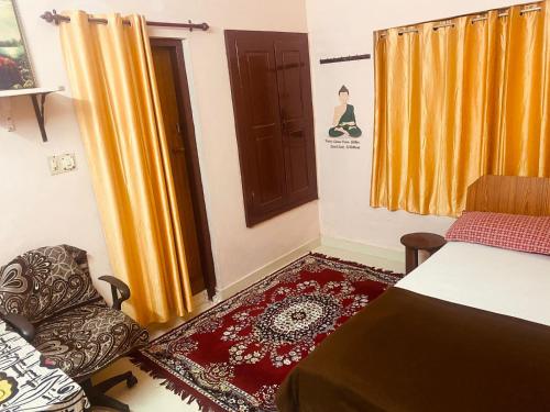 a room with a table and a chair and a door at Homestay - Heaven Aumgarden in Trivandrum