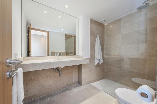 a bathroom with a sink and a mirror at Apartment Roqueta in Pollença