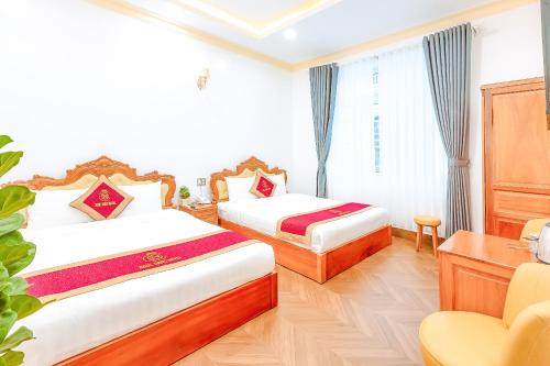 Ένα ή περισσότερα κρεβάτια σε δωμάτιο στο Ngọc Sang 2 Hotel
