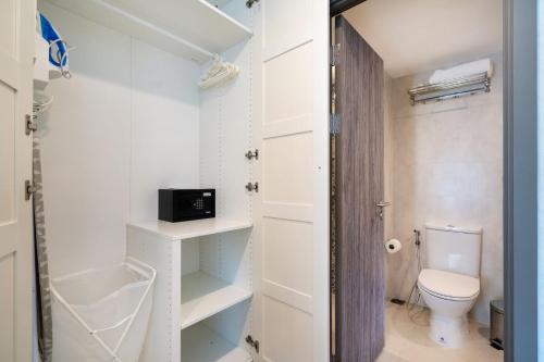 a small bathroom with a toilet and a sink at F12 Номер Люкс Бассейн Рубль ВАТСАП669З582I976 in Nai Yang Beach