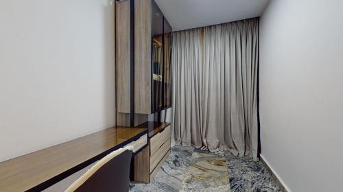 a living room with a tv and a window at YANNA APARTMENT BY KHALIQUES in Abuja