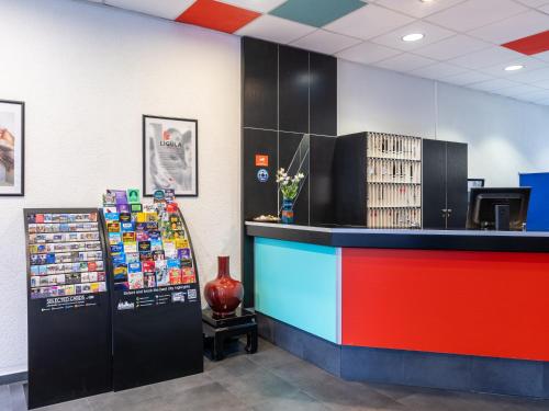 a store with a colorful counter in a room at Good Morning Berlin City West in Berlin