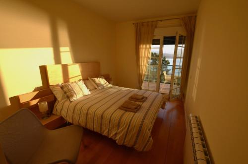 Posteľ alebo postele v izbe v ubytovaní Apartamento pie de playa Finisterre