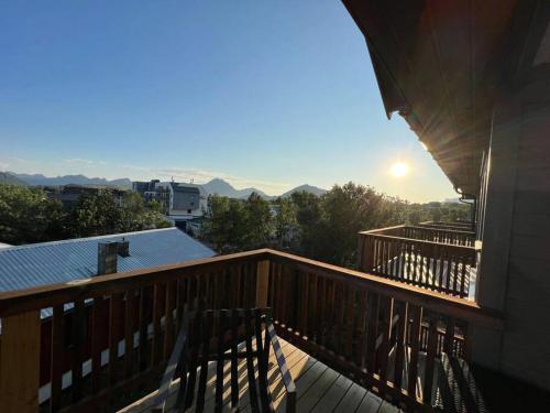 a balcony of a house with a view of the mountains at Nyleilighet midt i sentrum in Leknes