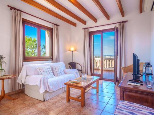 A bed or beds in a room at Apartment Finca Can Corritx-1 by Interhome