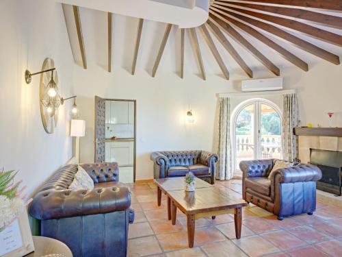 a living room with two couches and a table at Villa Villa Bellevue by Interhome in Jávea