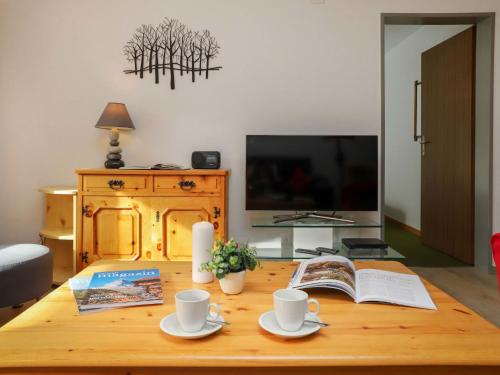 TV a/nebo společenská místnost v ubytování Apartment Primavista-3 by Interhome