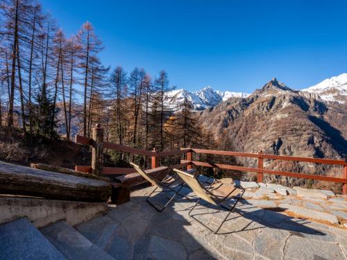 a couple of chairs sitting on top of a mountain at Studio Ancienne Bergerie Studio 1 - VOU140 by Interhome in Valtournenche