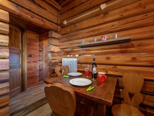 a wooden dining room with a table in a cabin at Studio Ancienne Bergerie Studio 3 by Interhome in Valtournenche