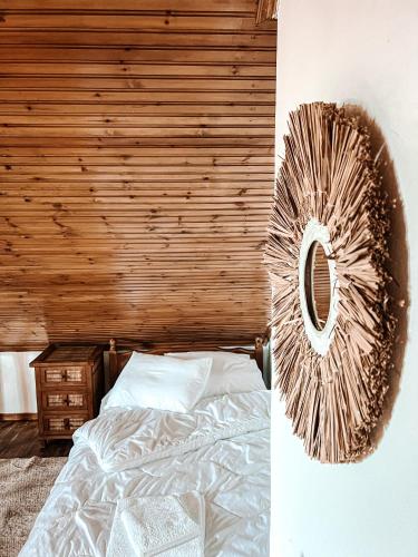 a bedroom with a bed and a mirror on the wall at PANOS PALACE in Pramanta