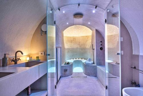 a bathroom with a glass shower and a sink at GOCCE VILLAS - Villa Degli Dei Scirocco in Vico Equense