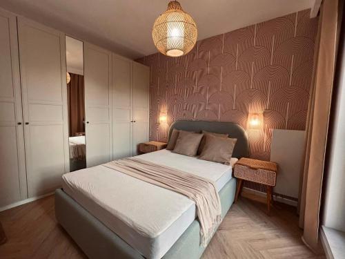 En eller flere senger på et rom på Boho BOTANIC GARDEN APARTMENT centrum Wrocław