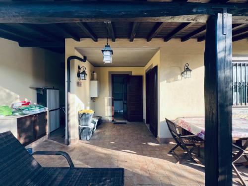a living room with a table and a dining room at Casa Luca 1C in Sasso