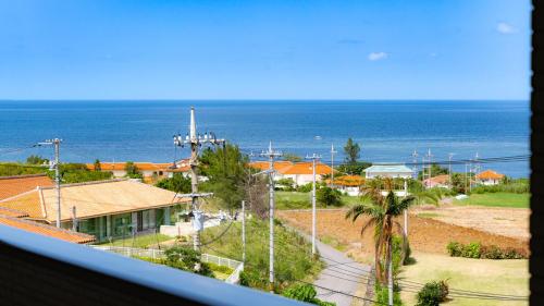 a view of the ocean from a house at Little Mermaid Hotel Ishigakijima in Ishigaki Island