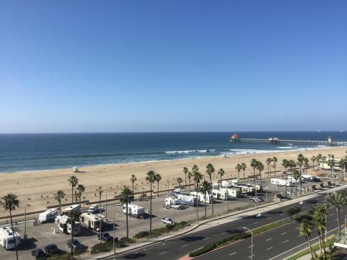 a parking lot with a beach and a pier at Paséa Hotel & Spa in Huntington Beach