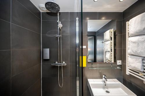 a bathroom with a shower and a sink at Staycity Aparthotels Marseille Centre Vieux Port in Marseille