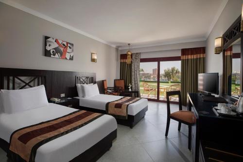 Katil atau katil-katil dalam bilik di Pyramisa Island Hotel Aswan