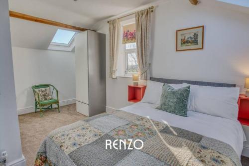 a bedroom with a king sized bed and a window at Spacious and Homely 2-bed Home in Lincoln by Renzo, Stunning Countryside Location, Free Parking! in Stow
