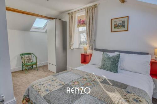 a bedroom with a king sized bed and a window at Inviting 2-bed Home in Lincoln by Renzo, Stunning Countryside Location, Free Parking! in Stow