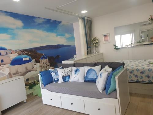 a bedroom with a bed and a large window at CALTERR - Loft con Terraza privada, Wifi, Recién reformado in Torremolinos