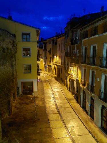 an empty street in a city at night at Hospederia Chapitel in Estella