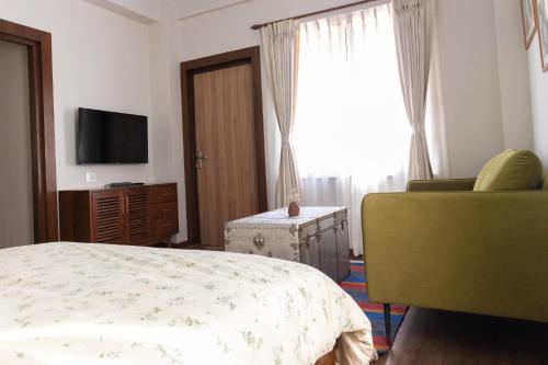 Postel nebo postele na pokoji v ubytování Kibu Apartments